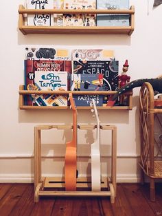 two wooden shelves with books on top of them