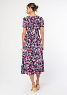 A lightweight bohemian midi dress in a bright multicolor floral print. A bright, multicolor floral print adds an eye-catching touch to this classic mid-length dress, featuring a flattering surplice v-neckline, short sleeves, and a relaxed fit. The drawstring waist can be tied tight for a waist-defining look, or wear it loose for a relaxed & comfortable fit. Floral print Relaxed fit Short sleeve Mid-length Surplice v-neckline Hook & eye closure Adjustable drawstring waist Women's bohemian dress M Multicolor V-neck Floral Dress With Vibrant Print, Spring Floral V-neck Dress With Vibrant Print, Multicolor Floral Print V-neck Dress, Multicolor Floral V-neck Dress With Vibrant Print, Fitted Midi Dress With Floral Print And Surplice Neckline, Multicolor Floral Print Midi Dress, Flowy Multicolor Floral Dress With Vibrant Print, Multicolor Flowy Floral Dress With Vibrant Print, Floral Print Multicolor Midi Dress