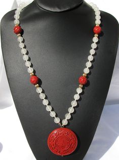 "Picked this up a local auction. This is cinnabar and white quartz, but I am not sure how to age it. This has tremendous eye appeal. The pendant measures 2\" by 2\" and is approximately 1/2\" thick. There are 4 cinnabar carved beads that measure approximately 9/16\" in size. The white quartz beads are 12mm or 3/8\". This is linen threaded and knotted. The total length of the necklace is 31\". Substantial piece, weighing in at over 4 ounces." Ceremonial Red Jewelry With Large Beads, Artisan Red Ceremonial Necklaces, Traditional Red Hand-strung Beaded Necklaces, Red Hand-strung Beaded Necklace, Ceremonial Large Red Beads, Red Beaded Necklaces, Embroidered Handbag, Copper Cuff, Red Necklace