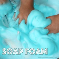 a child is playing with soap foam in a bathtub that has the words soap foam on it