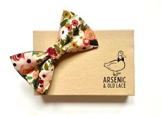 "This beautiful bow tie has been lovingly handmade in Nottingham, England using a Rifle Paper Co. burgundy, maroon, green and blush peach floral print. It comes as a large butterfly pre-tied bow tie or a self-tie that both have adjustable straps. DETAILS - Straps fit up to a 19\" neck (custom sizes available upon request) - Dimensions of tied bow - 2 1/2\" high x 4 1/4\" wide - Suitable for men or women - Each bow tie comes in its own recycled, hand-stamped presentation box, with personalised note cards available with every order - Free swatches available - just ask - Spend £75 or more and get 10% off your entire purchase by entering code COW18 at the checkout ALSO AVAILABLE 👉🏽Boys/toddler/baby bow tie - just drop us a message at the checkout stating the little fellas age if you would li Bowtie Pattern, Baby Bowtie, Floral Bow Tie, Paper Bow, Tie Pattern, Pre Tied Bow Tie, Boys Bow Ties, Nottingham, Personalized Labels