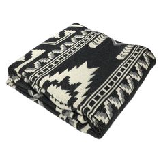 a black and white blanket folded on top of each other