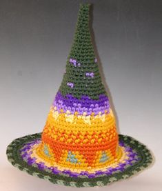 Judy has made these one of a kind Witch Hats for the pure joy of it for years. These are her evening projects to relax and have fun with color and pattern, her two loves! This design is made custom for you, you just select and send a color pallet and turn her loose. Check the stitch detail on these. Judy uses a tight uniform stitch to create a firm hat that stands on its own. She includes a soft wire in the edge so you can sculpt the brim to fit your mood. Each hat is unique, and average over 80 Playful Multicolor Costume Hats, Fun Multicolor Costume Hats And Headpieces, Fun Multicolor Costume Hat, Whimsical Handmade Multicolor Crochet Hat, Whimsical Multicolor Handmade Crochet Hat, Handmade Multicolor Crochet Hat Whimsical Style, Whimsical Multicolor Hats For Gifts, Handmade Multicolor Whimsical Crochet Hat, Handmade Multicolor Crochet Hat