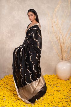 Expertly crafted with pure Katan silk, this black Banarasi saree features intricate Kaduwa sona rupa motifs. The traditional design and luxurious fabric make it a versatile addition to any wardrobe. Elevate your style with this exquisite and timeless piece. Black Cotton Silk Pre-draped Saree For Diwali, Festive Black Pre-draped Saree With Cutdana, Black Art Silk Pre-draped Saree With Zari Weaving, Traditional Black Pre-draped Saree, Black Silk Saree With Resham Embroidery, Black Pre-draped Saree With Pallu For Festive Occasions, Black Silk Pre-draped Saree With Resham Embroidery, Black Silk Pre-draped Saree For Eid, Elegant Black Pre-draped Saree With Zari Work