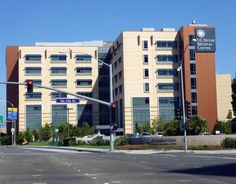 an empty street in front of a large building