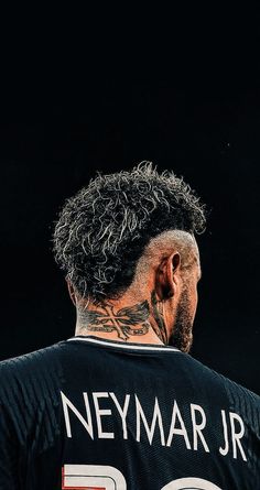 a man with a tattoo on his neck wearing a jersey