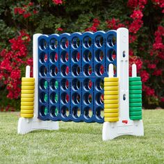 an inflatable game set on the grass with flowers in the backgroud