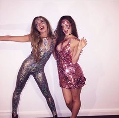 two women in sequins posing for the camera