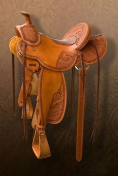 a horse saddle hanging on the wall