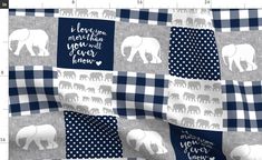 an elephant patchwork quilt with blue and white checkered squares on the bottom half