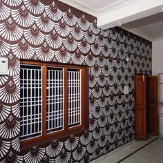 the room is decorated with intricate wall paper