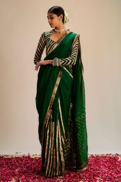 Dark green saree with striped pattern gota work and soft organza pallu. Comes with coordinating gota work blouse. - Aza Fashions Fitted Green Saree With Pallu Detail, Fitted Green Saree With Pallu, Green Fitted Saree For Festive Season, Fitted Green Saree For Festive Occasions, Green Traditional Wear For Transitional Party Season, Green Transitional Traditional Wear For Party, Designer Green Saree With Sheer Dupatta, Green Cutdana Blouse For Eid, Pista Green Pre-draped Saree For Eid