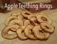 apple teeth rings on a cutting board with the words apple teeth rings in front of them