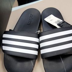 Adidas Adilette Comport Adj Sporty Adidas Sandals With Adidas Logo, White Adidas Sandals For Sports, Sporty Adidas Sandals With Logo, Casual White Adidas Sandals, Adidas White Sandals For Sports, Summer Adidas Sneakers With Synthetic Material, Adidas Sporty White Sandals, Sporty White Adidas Sandals, Sporty Black Sandals