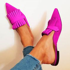 These fuchsia mules feature a chic pointy toe and trendy fringe accent. Crafted from supple vegan suede, these flats offer both comfort and style, making them a versatile addition to your wardrobe. Perfect for any occasion, these shoes ensure a secure fit and a fashion-forward statement. HandcraftedUS sizing. Fits true to size. Chic Pointy Toe Design: The fuchsia mules boast a sleek and stylish pointy toe, offering a fashionable touch to any outfit. Supple Vegan Suede Material: Crafted from high-quality vegan suede, these flats offer comfort and durability, perfect for all-day wear. Fringe Accent: Adorned with a trendy fringe detail, adding a playful and eye-catching element to your ensemble. Versatile Style: Ideal for various occasions, these shoes transition seamlessly from casual to sem Trendy Suede Pointed Toe Mules, Summer Suede Pointed Toe Flats, Pink Suede Flats, Chic Pink Pointed Toe Mules, Chic Pink Flat Mules, Pink Pointed Toe Flats For Spring, Chic Pink Pointed Toe Flats, Pointed Flats Shoes, Fringe Shoes