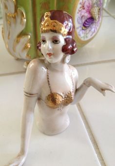 a ceramic figurine sitting on top of a counter