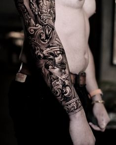 a man with a tattoo on his arm