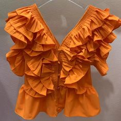 44487996113118|44487996145886|44487996178654 Solid Tops With Ruffles For Summer, Solid Color Ruffled Tops For Summer, Solid Ruffled Tops For Summer, Ruffled Tops For Beach, Casual Sleeveless Ruched Blouse, Sleeveless Ruffled Blouse, Fitted Blouse With Ruffled Straps For Day Out, Beach Blouse With Ruffles, Chic Orange Blouse With Ruffles