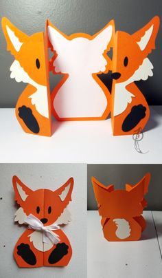 an origami cut out of paper with the shape of a fox on it