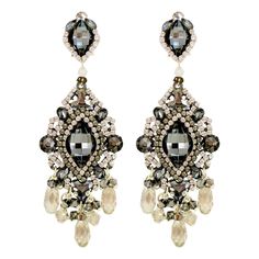 We have never seen so much sparkle EVER! These earrings are really all a dark grey/black crystal Swarovski and silver colored. The light sometimes catches them in a way that their colors change like what you see in the picture. And all the sparkle literally makes them dance and dazzle. These earrings by DUBLOS are amazing! 3.75"L X 1.25"W Hand-placed Swarovski crystals and strass Pierced Omega Back, Light weight Handmade in Seville, Spain More about DUBLOS and where we discovered it: The couture Spanish Jewelry, Filigree Pendant Necklace, Beaded Bib Necklace, Crystal Chandelier Earrings, Cats Eye Stone, Seville Spain, Bronze Ring, Artisan Earrings, Open Bangle