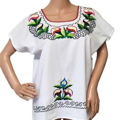 Wonderful vintage embroidered folk mexican blouse. This unique blouse was homemade from cotton with a beautiful embroiderer floral motives. I suppose it fits well size M / L. Please take a look at measurements /FLAT/ Shoulder to shoulder approx 15''/39cm Armpit to armpit: 22''/ 56cm length 25''/ 64cm Condition - very good, like unused More embroidered blouse https://www.etsy.com/shop/DejaVuShopGifts?search_query=embroidered+blouse Cotton Folk Blouse With Machine Embroidery, Folk Style Cotton Blouse With Machine Embroidery, Cotton Tops With Floral Embroidery For Cinco De Mayo, Embroidered Cotton Blouse For Cinco De Mayo, Cotton Blouse With Multicolor Embroidery For Cinco De Mayo, Cinco De Mayo Multicolor Embroidery Cotton Blouse, Cinco De Mayo Cotton Blouse With Multicolor Embroidery, Floral Motives, Floral Hand Embroidery