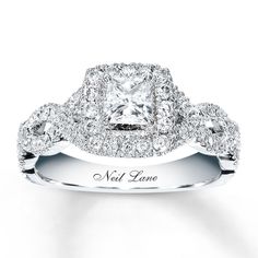 a diamond engagement ring with two rows of diamonds on the band and an inscription that reads,