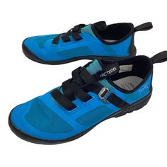 a pair of blue shoes with black straps