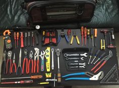 tools are laid out on a black table