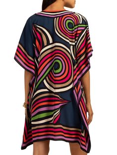 Lightweight and colorful, this floaty silk caftan is beautifully worn as a poolside swimsuit cover-up, or as a top for date night in the city; this wardrobe-essential is the piece you'll want in more than one color or pattern. Round, cutout neckline Relaxed, caftan fit Length: 36" Model is 5'10", wearing size XS/S FABRIC: Linear Fleur-de-Lis Silk Crepe de Chine 100% Silk Dry clean only Imported V-neck Viscose Kaftan For The Beach, Vibrant Print V-neck Kaftan For Beachwear, Multicolor Silk Printed Tunic, Vibrant Print V-neck Tunic, Chic Silk Kaftan For Beach Cover-up, Chic Silk V-neck Kaftan, Chic Printed Beach Dress, Bold Summer Vacation Dresses, Silk V-neck Kaftan For Beachwear