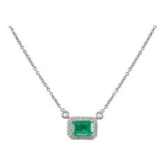 This is part of Chairish’s Fine Jewelry assortment.  Natural Emerald Diamond Halo Chain Necklace with in 18K Gold studded with octagon cut emerald and round cut diamonds. This stunning piece of jewelry instantly elevates a casual look or dressy outfit.  Emerald enhances intellectual capacity of the person. Designed with a octagon cut emerald set in center with layer of diamonds studded around it making a stunning delicate necklace. This is a perfect Unique Gift, Bridal Shower Gift, Secret Santa Emerald Diamond Necklace For Formal Occasions, Formal White Gold Emerald Diamond Necklace, Formal Emerald Diamond Necklace In White Gold, Elegant Emerald Diamond Cut Necklace, Formal Emerald Necklaces With Diamond Cut, Fine Jewelry Emerald Necklaces With Diamond Accents, Formal Emerald Necklace With Diamond Cut, Elegant Emerald Cut Emerald Necklace For Formal Occasions, Rectangular Diamond Gemstone Necklace