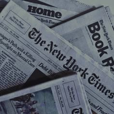 newspapers are stacked on top of each other with the word'new york times'printed on them