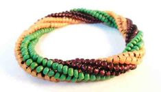 multicolored beaded bracelets on white background