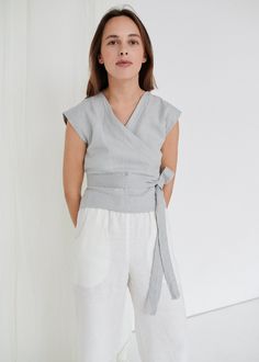 "SIZING & FIT This garment is true to size, and we recommend choosing the size you usually wear. If you want the garment to be loose-fitting, choose a larger size than you usually wear. Before placing an order, check the approximate measurements of the finished garment given below. Model is 5′6″ (170cm) tall with an 80cm/31″ bust, 68cm/26″ waist, 91cm/35″ hip, and she is wearing an XS in ice grey. XS Length ± 50cm | 19.7\" Bust ± 92cm | 36.2\" Sleeve length from neckline ± 14.5cm | 5.7\" Sle Casual Linen Wrap Top For Summer, Summer Gray Linen Top, Casual Linen Wrap Top, Sleeveless Wrap Top, Gray Linen, Grey Top, Top Sleeveless, Linen Top, Wrap Top