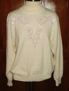 This is for a Ugly Christmas Sweater - Alfred Dunner Petite Large Beaded Cream White Sweater. This measures 24 inches long. 18 inches across the shoulders. 16 inch hem/waist line, 21 inch bust. Measurements of front so double for all the way around. Used but well taken care of with No ware, stains, smells, marks or other issues. Alfred Dunner Sweaters, La Crosse, Womens Sweaters, Alfred Dunner, Vintage Sweater, White Sweater, Vintage Sweaters, White Sweaters, Ugly Christmas