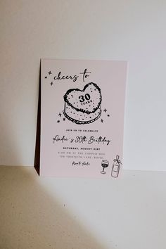 a card with a heart shaped cake on it