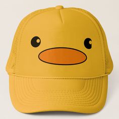 a yellow hat with an angry face drawn on it