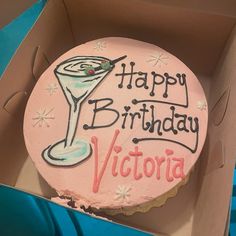 a birthday cake in a box with the words happy birthday victoria written on it's frosting