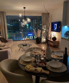 a dining room table is set with plates and silverware