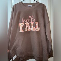 Nwt Pink Lily Boutique Hello Fall Oversized Mocha Brown Floral Sweatshirt. Brand New With The Sticker Tag Still Attached. Nice Oversized Fit, Great For Leggings! Be Comfy And Cute At The Same Time. Floral Print Writing. Nice Mocha Brown Color. Oversized Brown Graphic Print Sweatshirt, Brown Oversized Graphic Print Sweatshirt, Oversized Brown Sweatshirt With Graphic Print, Trendy Oversized Brown Sweatshirt, Oversized Brown Sweatshirt For Spring, Print Writing, Pink Lily Boutique, Floral Sweatshirt, Mocha Brown