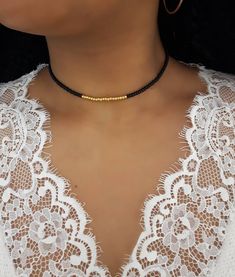 "Black and Gold Seed Choker - Black Beaded Choker - Gold Beaded Choker - Gold Seed Choker - Stretch Bead Choker - Seed Bead Jewelry - Dainty Seed Choker * D E T A I L S * This choker is made with size 8 Seed beads that are strung onto durable Stretch Cord and is finished with a Lobster clasp.  * S I Z E * This choker is avaliable in the following sizes: 11 inches 11.5 inches  12 inches  12.5 inches 13 inches  13.5 inches  14 inches  Each choker comes with a 2\" extension chain.  * Q U E S T I O Cheap Brown Jewelry With Gold Beads, Black Beaded Choker As Gift, Black Beaded Necklace With Gold Beads As Gift, Black Beaded Necklace With Gold Beads For Party, Adjustable Black Beaded Chain Choker, Elegant Black Beads With Gold Details, Adjustable Black Choker With Colorful Beads, Black Round Beads Choker For Festival, Black Tiny Beads Choker Necklace