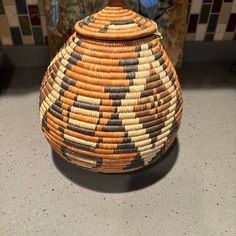 a woven basket sitting on top of a counter