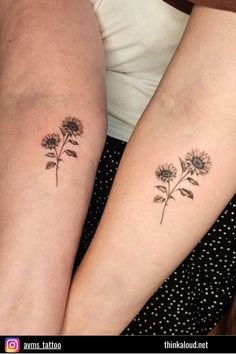 two women with matching tattoos on their arms, both have sunflowers tattooed on them