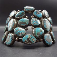 "VINTAGE NAVAJO BRACELET DESCRIPTION: This extraordinary cuff features 20 specimens of natural Blue Diamond turquoise. The high blue gemstones are secure in micro-serrated bezel, on a foundation of heavy gauge vintage sterling silver. This mesmerizing bracelet will be a cherished addition to your collection of fine vintage Native American jewelry. MEASUREMENTS: Interior of the cuff measures 5 3/4\" with an additional 1 1/8\" non-adjustable gap. Total circumference: 6 7/8\" Measures 2 1/2\" strai Blue Gemstone Cuff Bracelet, Natural Blue Diamond, Jewelry Measurements, Bones Bracelet, Vintage Native American Jewelry, Navajo Bracelet, Butterfly Pictures, Vintage Navajo, Classic Jewelry