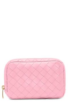 Perfect as an everyday makeup bag or a travel essential, this pretty-pink pouch with a signature handwoven intrecciato construction will always be appreciated. Zip-around closure Canvas lining Leather Made in Italy Designer Handbags Luxury Intrecciato Weave Clutch For Travel, Intrecciato Weave Clutch Pouch For Travel, Luxury Pink Pouch For Everyday Use, Luxury Pink Rectangular Coin Purse, Luxury Pink Rectangular Cosmetic Bag, Designer Pink Pouch For Everyday Use, Designer Pink Travel Pouch, Luxury Pink Cosmetic Bag For Everyday Use, Luxury Pink Clutch For Travel