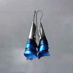 Avant garde efective earrings. They look fantastic on ear. They are made of oxidized sterling silver and silk ogranza in beatutif dark blue and blue colors. Earrings are effective and light. Enjoy colorful world of Shambala A few words about our works: All of the products in gallery are designed by us. Our studio is located in the beautiful seaside city of Gdańsk at Świętokrzyska Street. Everything is 100% handmade, with special attention to detail. In our work, you can find many collections ins Blue Bridal Earrings, Seaside City, Navy Blue Earrings, Fairy Earrings, Art Nouveau Earring, Wedding Silver, Blue Bridal, Emerald Earrings, Earrings Blue