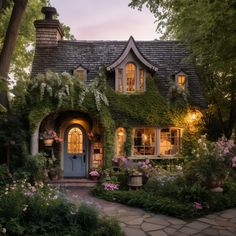 a house covered in vines and flowers at dusk