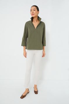 Your staple style gets a fresh update with the Sullivan Blouse. Made from a lightweight and crisp cotton material that provides effortless polish, this stand collared shirt is a must-have in any closet. Style it with denim and sneakers for off-duty weekend wear, under a cardigan with boots when the temps drop, or with a sweet skirt and ballet flats for feminine flair. Stand collar V-neckline Bracelet length sleeves with split cuffs Swingy fit Material: 95% Cotton, 3% Spandex Care: Dry clean only Olive Cotton Top With Pockets, Collared Olive Shirt With Button Closure, Olive V-neck Tops For Spring, Olive Military Style Collared Top, Olive Military Style Button-up Top, Stand Collar Blouse, Stand Collar Shirt, Plus And Minus, Collared Shirt