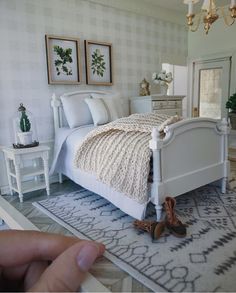 someone is taking a photo of the bedroom in their doll house