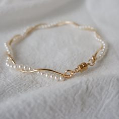 Twisted Pearl Wrap Bracelet – Luxandluxy Gold Wire Wrapped Pearl Bracelets, Gold Wire Wrapped Pearl Bracelet For Weddings, Pearl Bangles Gold, خواتم خطوبة, قلادات متدلية, Bangle Gold, Pearl Bangle, Jewelry Accessories Ideas, Classy Jewelry