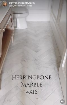 the herringbone marble bathroom floor is 4x16